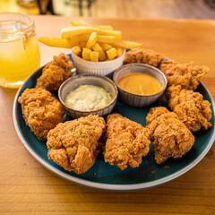chicken crackling with french fries, chili bell pepper and mayonnaise