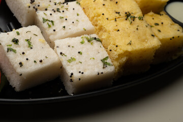 Indian popular Gujrati breakfast dish White Dhokla, Khatta , Rice and Urad Dal Khaman. Also known as Instant Rava Dhokla AND yellow dhokla or besan gram flour. served with ketchup 
