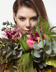 beautiful young girl with a bouquet of flowers - 537556493
