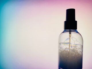 bottle of perfume on blue background