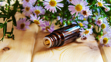 flower oil in glass bottles.homeopathy.selective focus