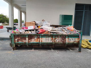 MELAKA, MALAYSIA -MAY 2, 2022: Huge wasted disposal bin used to collect rubbish and unused...