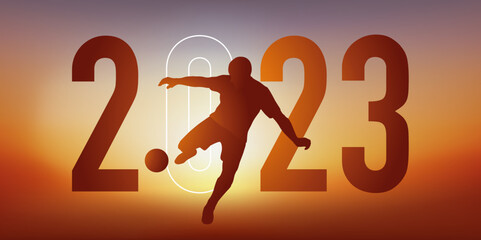 Concept du sport sur le thème du football pour une carte de vœux 2023, montrant un footballeur qui frappe le ballon du pied pour marquer un but.