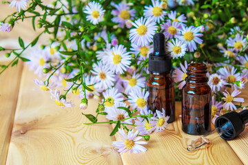 flower oil in glass bottles.homeopathy.selective focus