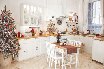 Christmas decoration on the kitchen. Kitchen interior holidays. New Year design.