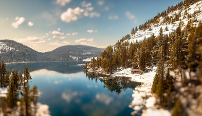 Mountain panorama of a beautiful Donner Lake at sunset. Autumn view with reflections in a lake....