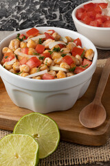 Delicious chickpea salad with tomato and onion.
