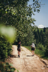 hiking in the mountains. hiker in the forest. The girl travels along the mountain paths. Carpathian Mountains