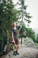 Obraz premium hiking in the mountains. hiker in the forest. The girl travels along the mountain paths. Carpathian Mountains