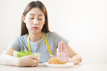Diet, Dieting asian young woman or girl push out, deny fried chicken, junk food and choose fresh...