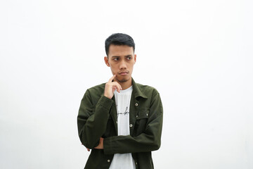 Asian man wearing casual green shirt is thinking. isolated white background