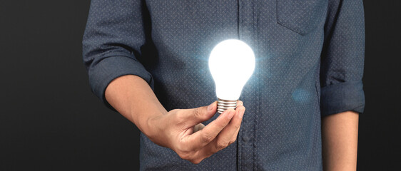 Humans hold light bulbs in hand innovative technology and creativity