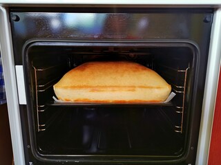 Cake in the oven, very puffy