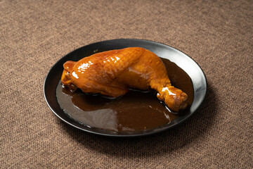 Braised Roasted Chicken Legs on Monochrome Background
