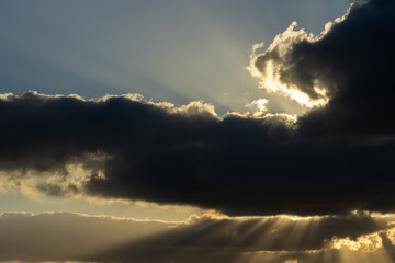 Sunlight streaming through clouds