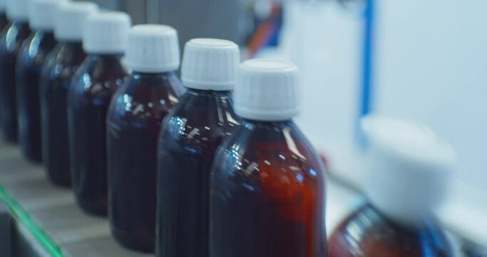closed plastic bottles move along the conveyor.close-up.