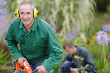 close up of a gardener wearing earmuffs