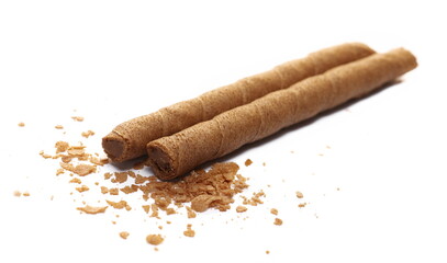 Waffle chocolate sticks and crumbs with of cream black chocolate and orange, isolated on white