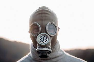 person in mask with gas mask