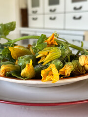 Fresh flowers of a small decorative pumpkin. Fried pumpkin flower as summer appetizers.