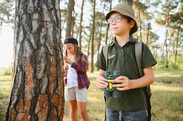 kids scouts in the forest.