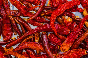 Red hot dried chili pepper on white background. Top view closeup.