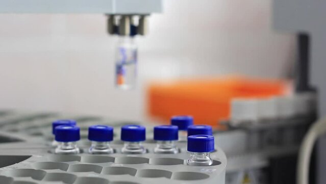 Vial with a vaccine against the virus on a special device