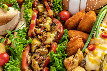 Set of Homemade burgers with grilled meat, vegetables, sauce French fries