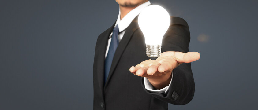 Humans hold light  bulbs in hand innovative technology