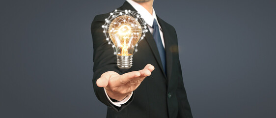 Humans hold light  bulbs in hand innovative technology