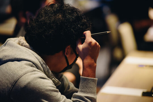People thinking in conference hall at business event