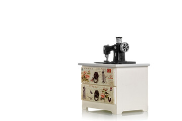 jewelry box with decorative sewing machine on a white background