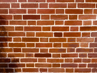 Fototapeta premium Texture of red brick wall in the city