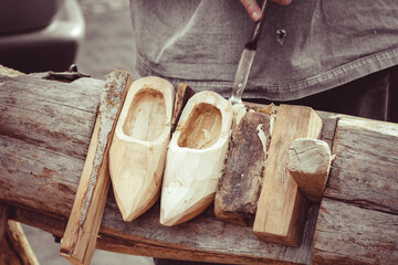 A Traditional Dutch Craft Of Making Wooden Traditional Shoes. The Making Of Clogs
