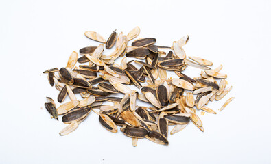 Helha from sunflower seeds on a white background. Purified cake from oil production.