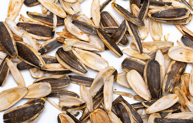 Helha from sunflower seeds on a white background. Purified cake from oil production.