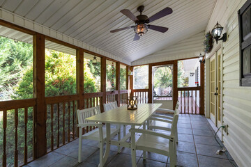 cozy and comfortable enclosed and screened porch sunroom 