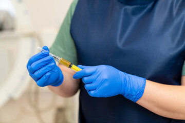 Injection prepairing in gloved hands. Hospital syringe laboratory researching.