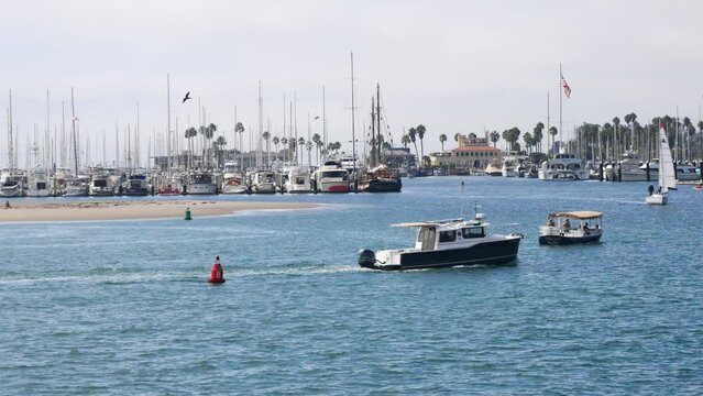 Boat arriving at the harbor near Stearns Wharf in Santa Barbara, California, USA
