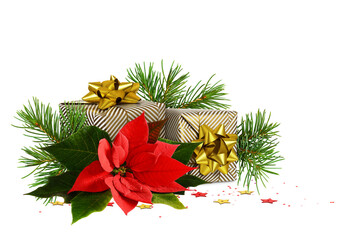 Two wrapped in festive paper gift boxes with green christmas twigs and red poinsettia flower on...