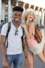 Obraz premium beautiful couple looking at camera and smiling while playing outdoors