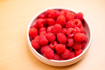 Raspberry fruit on the bowl