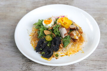 Country Style Pancit Palabok pasta noodles served in a dish isolated on grey background side view