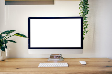 Picture of a computer screen isolated on white on desk at home office.