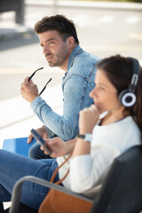 Obraz premium passengers hold phones waiting for transport