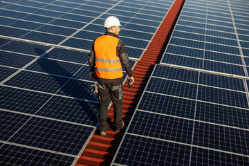 A worker on his way to fix solar panels.