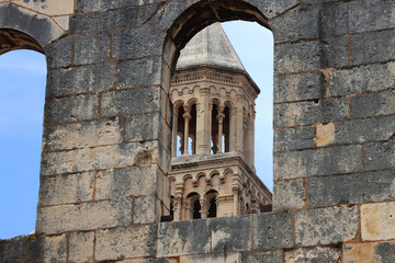 Fototapeta na wymiar Saint Domnius tower seen through The Silver Gate. Historical landmarks in Split, Croatia. Selective focus.
