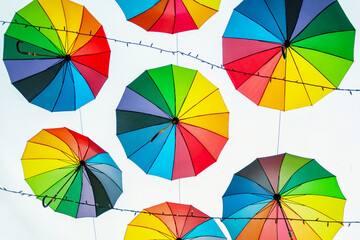 Colorful umbrellas on the sky background.	
