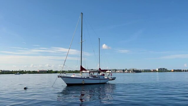 Dolly zoom footage of a white sailboat in Charlotte Harbor, Punta Gorda, FL