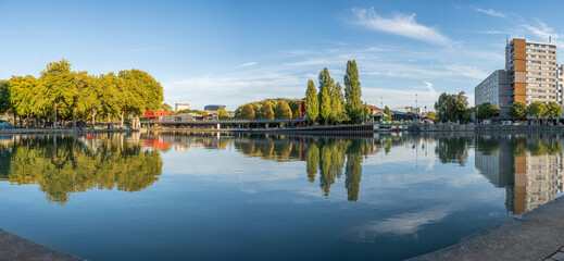 Paris, France - 11 07 2022: La Villette Park. View of the Canal of the Basin of the villette with reflects